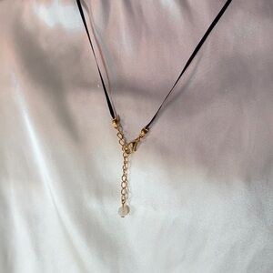 Black with gold rainbow moonstone necklace.